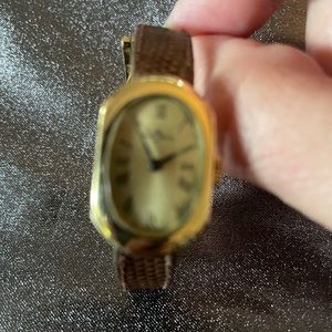 Vintage luxury Baume and Mercier ladies timepiece Christian Dior wrist band.